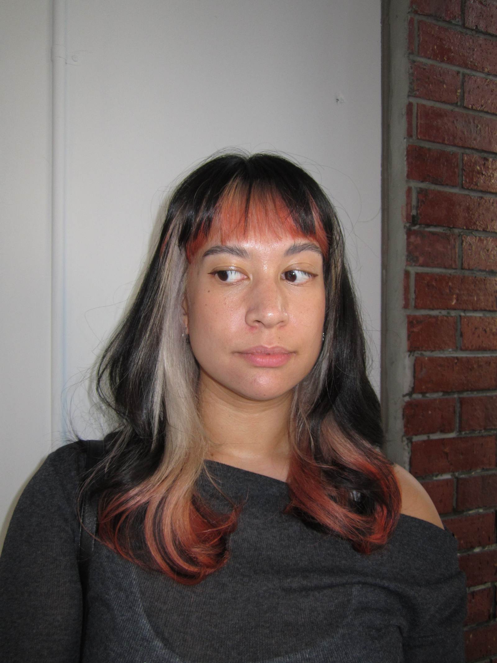 Creative color design at Assort Melbourne showing a bold contrast between bright cool-toned blonde and bold orange tips