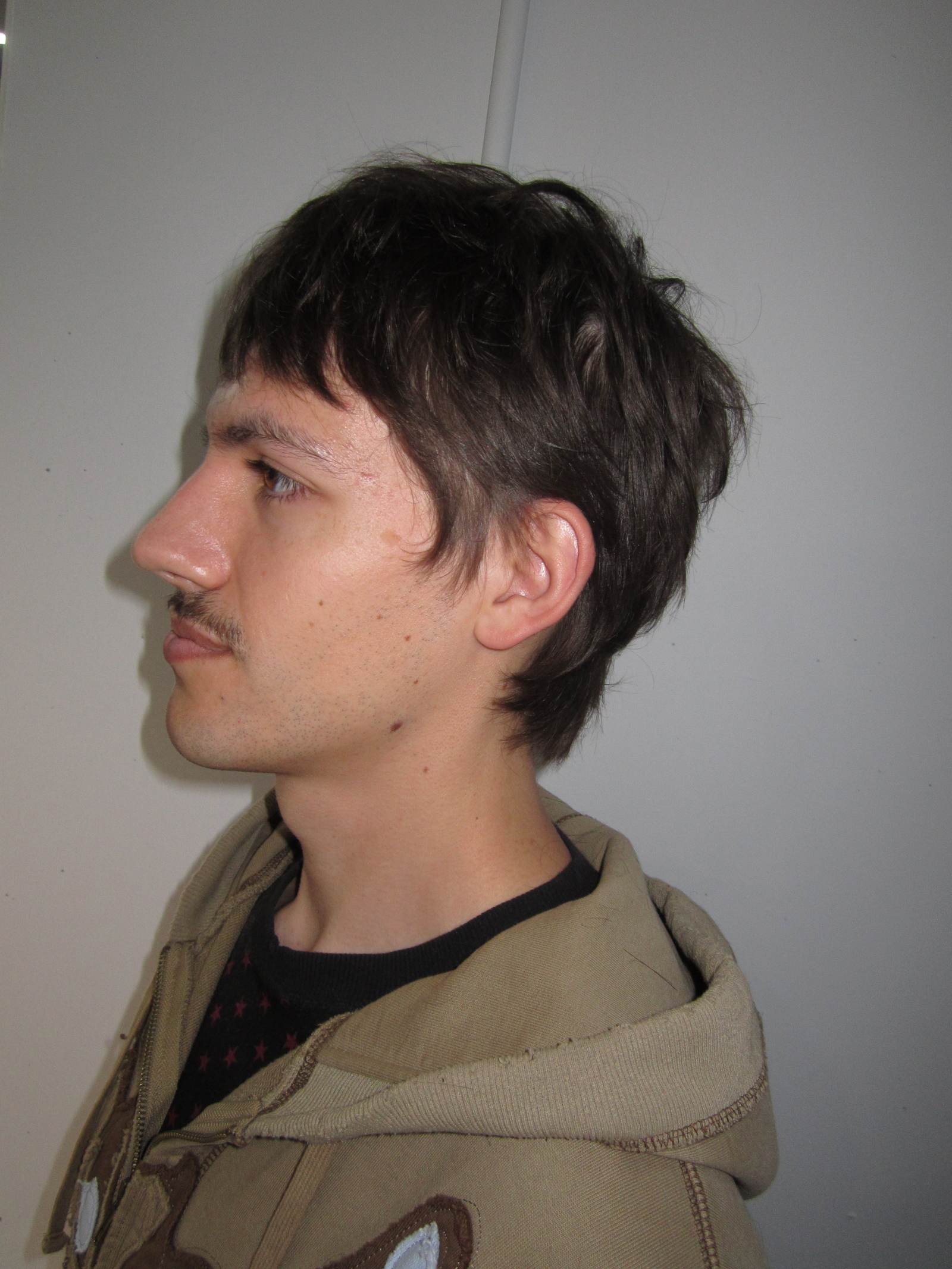 A man with an effortless "Modern Flow" hairstyle done at Assort Melbourne