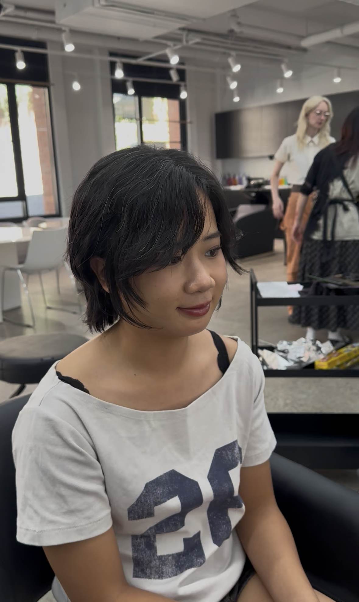Healthy bouncy textured bob with fringe and face-framing layers at Assort Melbourne.