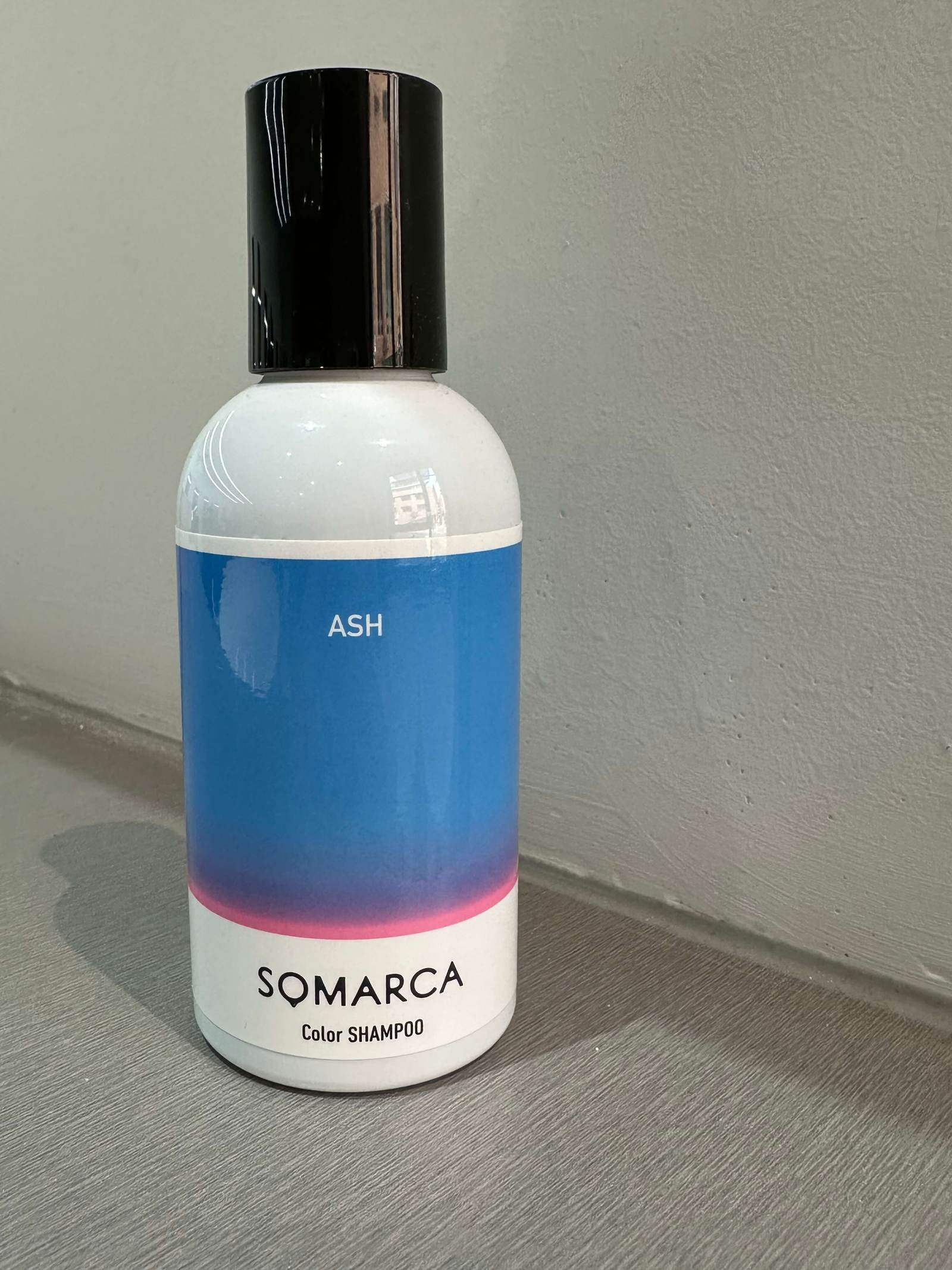 A bottle of Somarca Color Shampoo in Ash, recommended by Assort Melbourne for maintaining cool, icy blonde and platinum hair tones at home.