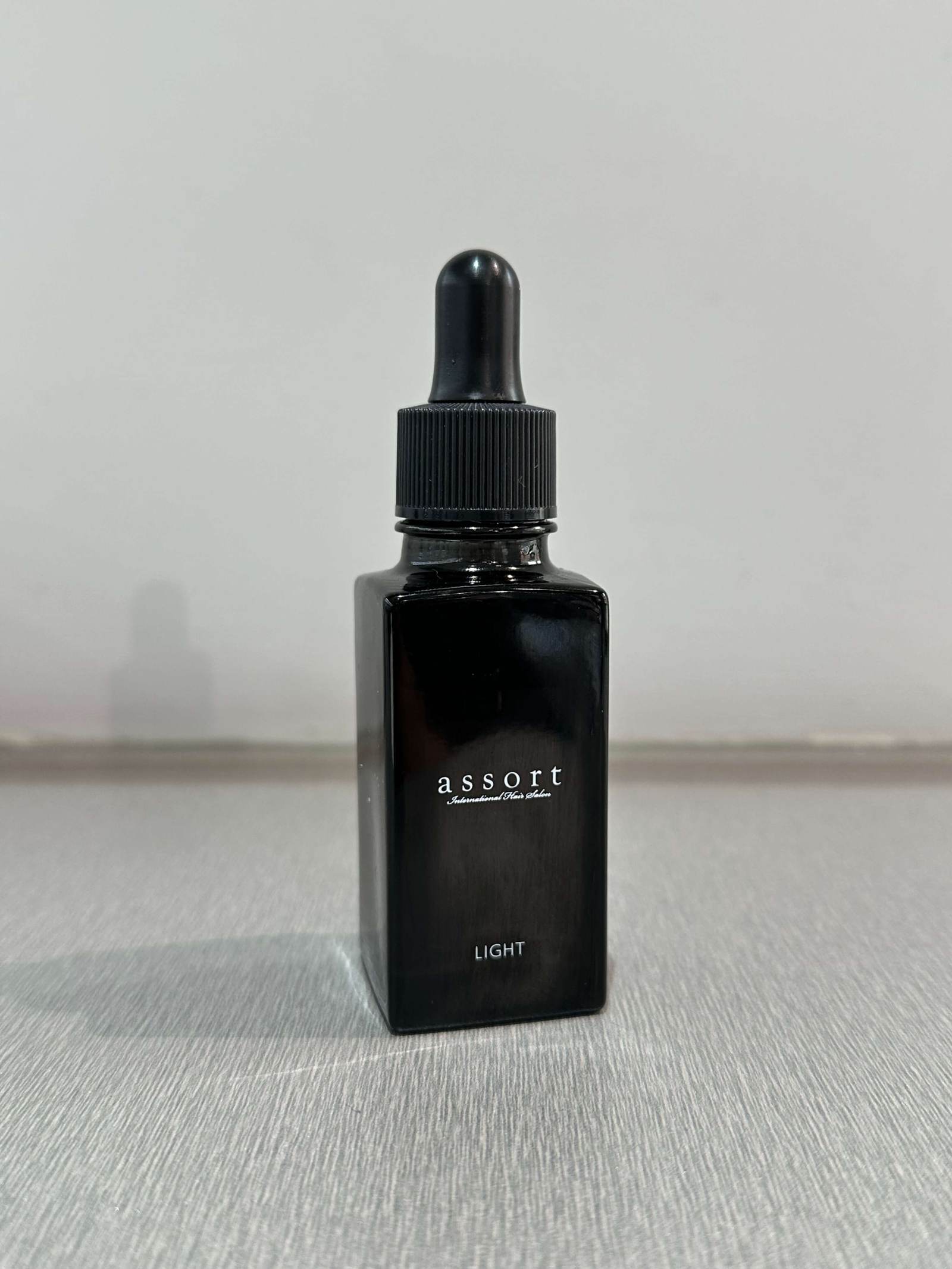A photo of Assort's Signature Oil used for maintaining healthy, voluminous bangs at Assort Melbourne.