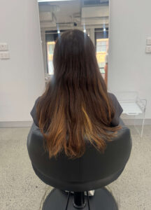 Long dark brown hair with previously bleached ends before a professional Double Process Creative Colour transformation.