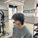 Before the hair transformation at Assort Melbourne: Men's natural dark curly hair 