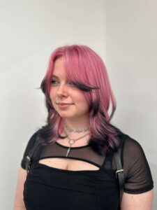 Creative color design at Assort Melbourne showing a bold contrast between bright pink and dark midnight-ink tips
