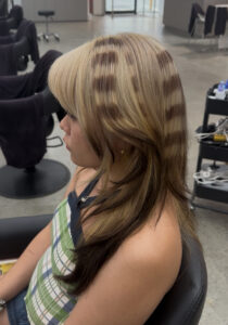 Blonde Triple Process Creative Colour with dark tips and Raccoon tail streaks at Assort Melbourne