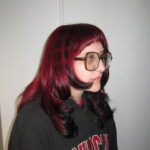A client at with bold Red hair done professionally at Assort Melbourne