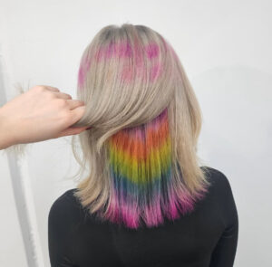 A client at with multi coloured hair with Rainbow design done professionally at Assort Melbourne