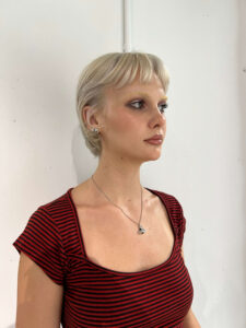 A client at Assort Melbourne featuring a textured Blonde Bixie haircut with soft, face-framing layers