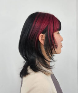 A client at Assort Melbourne with bold black and red color blocking.