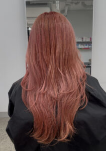 A Peachy Pink layered hair cut and colour done at Assort Melbourne