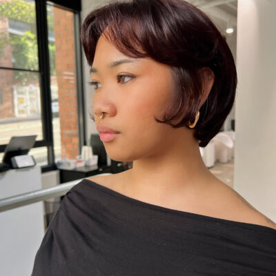 A client at Assort Melbourne featuring a textured Bixie haircut with soft, face-framing layers