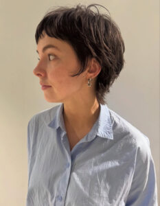 Side profile of a sculpted Femme Pixie showing weightless texture and shine, achieved using K18 Molecular Repair Hair Oil at Assort Melbourne.