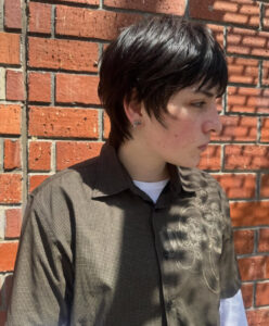 A modern Mod Cut with a heavy fringe and high-shine finish, a top trend for 2026.