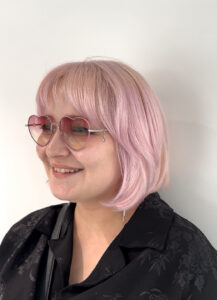 Soft, styled bangs on a client at Assort Melbourne showcasing a light and bouncy face-framing fringe