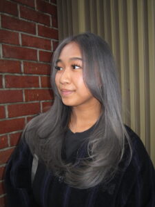 after hair transformation at Assort Melbourne showing outgrown bleach shifted to an even, high-shine grey double process.