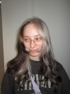 A stunning creative colour block hair transformation at Assort Melbourne, featuring a high-contrast silver section against natural dark hair with a glossy K18 finish.