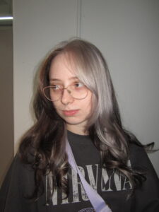 A stunning creative colour block hair transformation at Assort Melbourne, featuring a high-contrast silver section against natural dark hair with a glossy K18 finish.