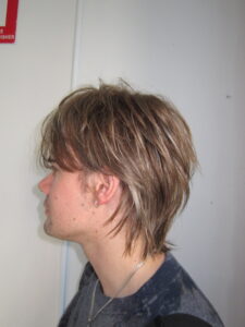 A man with an effortless "Modern Flow" hairstyle done at Assort Melbourne