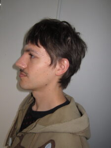 A man with an effortless "Modern Flow" hairstyle done at Assort Melbourne