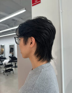 A man with an effortless "Modern Flow" hairstyle done at Assort Melbourne