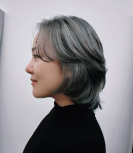 A stunning metallic silver layered bob with high-shine finish at Assort Melbourne.