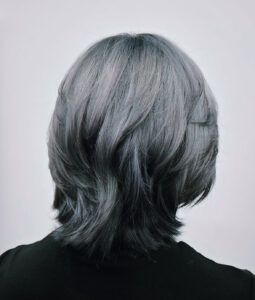 A stunning metallic silver layered bob with high-shine finish at Assort Melbourne.